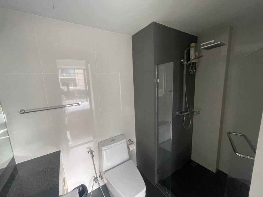IMG-20250307-6Ave-321-5 Walk-in shower in furnished studio, 6th Avenue Surin Phuket